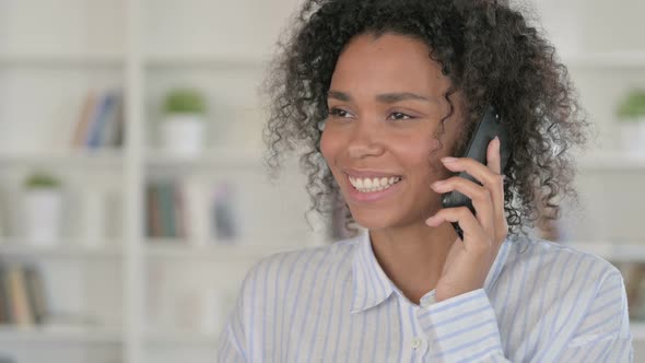 African Woman Talking on Smartphone