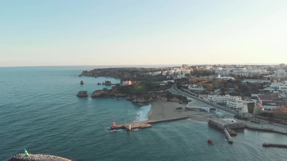 Scenic sunset view over Fort of Ponta da Bandeira next to the river's estuary, in Lagos, Algarve