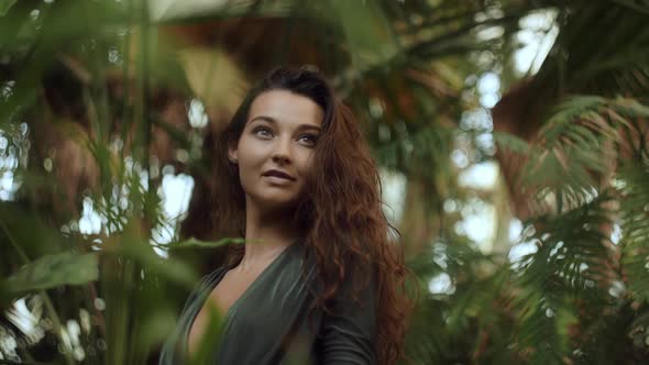 Woman Standing in the Tropical Jungle at Summer