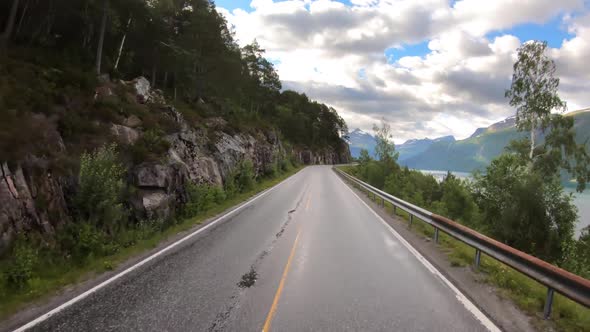 Vehicle Point-of-view Driving a Car on a Road in Norway