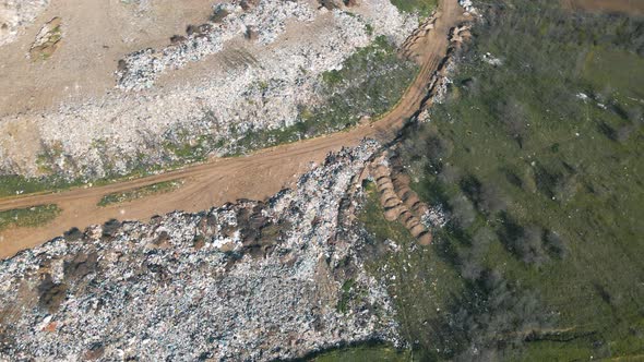 Aerial View of the Garbage Truck Near the Agricultural Lands