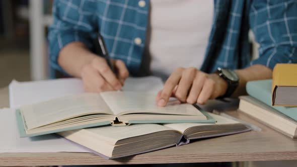 Closeup Male Hands Unrecognizable Young Male Student Sitting in Library Doing Homework Preparing