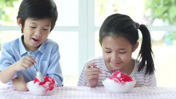 Happy Little Asian Children  Eating Shaved Ice At Home Slow Motion