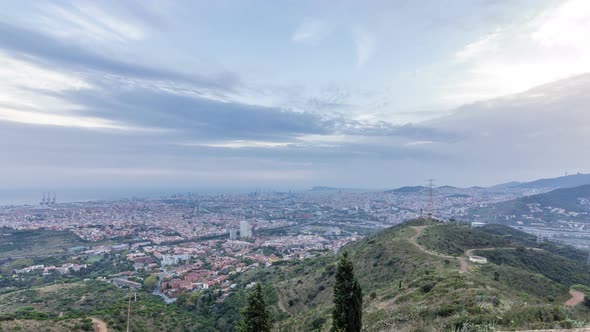 Barcelona and Badalona Skyline with Roofs of Houses and Sea on the Horizon at Evening Timelapse