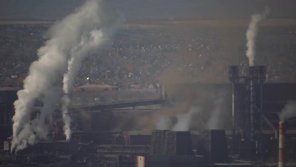 large amount of smoke and soot is emitted from the factory pipes of the metallurgical plant