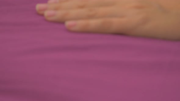 Blonde having sweet  dreams in the bed with purple covers  slow panning 4K 2160p UHD footage - Woman