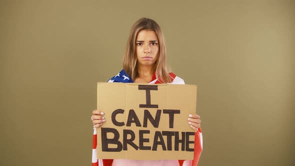 Young Girl Wrapped in Flag of USA