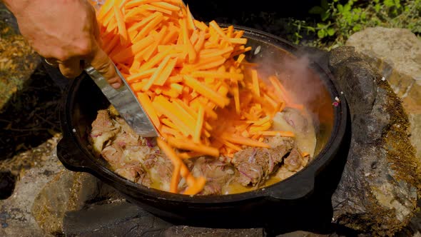 Old Retro Camp Cauldron For Beef Preparation On A Fire In Forest