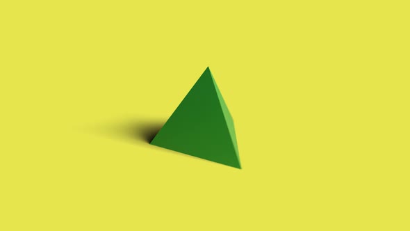 Tetrahedron spinning on a yellow background