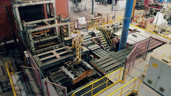 Automatized Machine Is Transporting Ceramics at Modern Industrial Factory Line