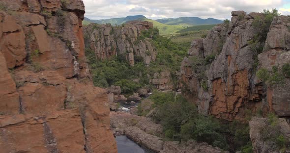 Drone Aerial Reveal shot near Blyde river canyon at the Amber 'Treur' Falls in Mpamalunga, South Afr