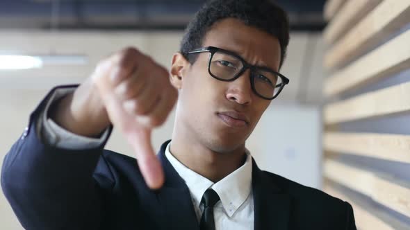 Thumbs Down by Black Businessman in Suit, Portrait