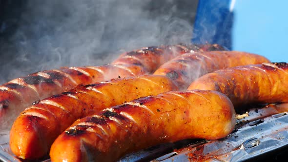 Sausages Grilling on Gas Grill