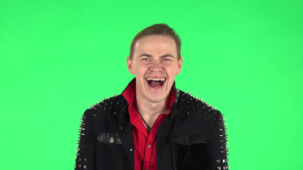 Guy Bursting with Laughter Being in Positive Over Green Screen