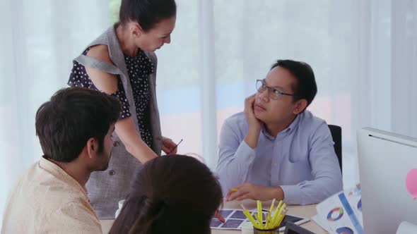 Unhappy Business People in Group Meeting After Project Failure