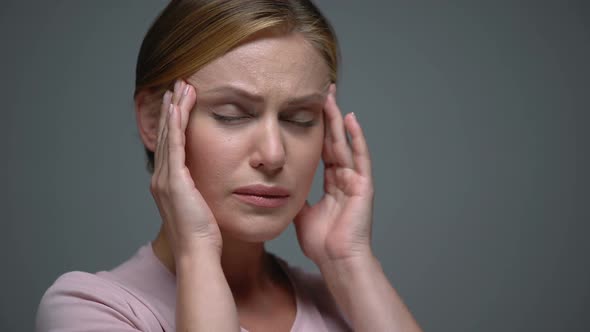 Worried Woman Massaging Temples Feeling Terrible Headache, Migraine, Pms