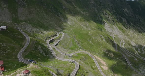 aerial view of part of winding transfagarasan road with moving cars