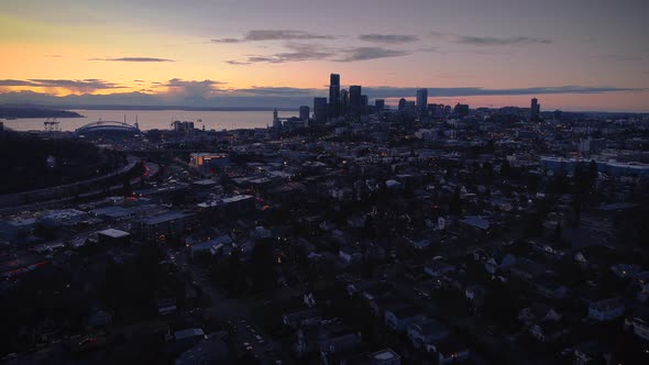 Dark Night Cityscape Aerial With Oceanfront Sunset