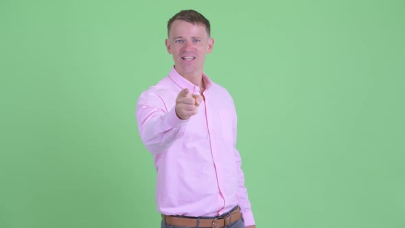 Portrait of Angry Businessman Pointing at Camera