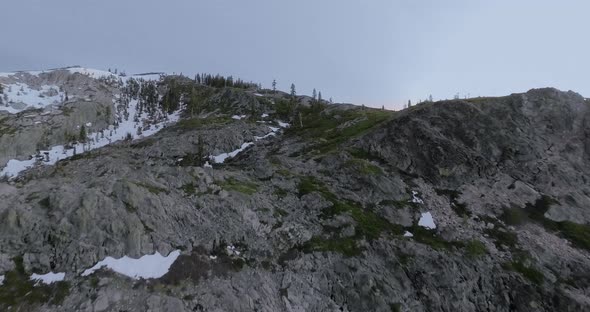 Drone slowly flying over grey rock in Shasta-Trinity National Forest, California