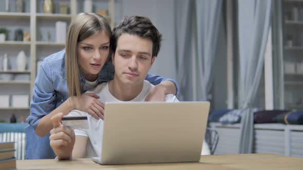 Young Couple Busy Doing Online Shopping on Laptop, Online Banking