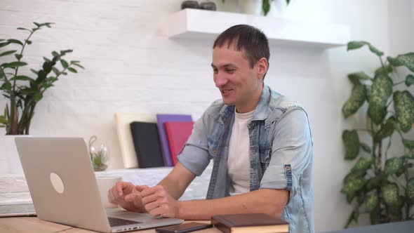 Technology Remote Job and Lifestyle Concept  Happy Man with Laptop Computer Having Video Chat