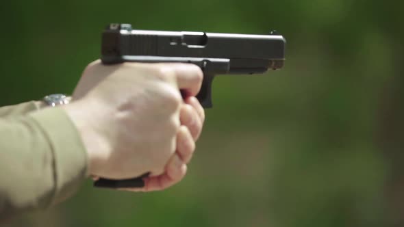 Close-up Shot of a Pistol. Slow Motion.