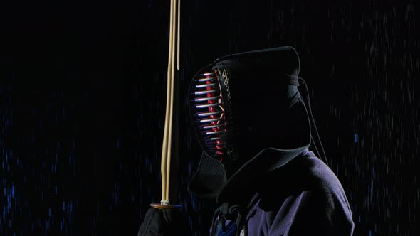 Side View of Japanese Kendo Fighter in Fighting Stance Holding your Shinai