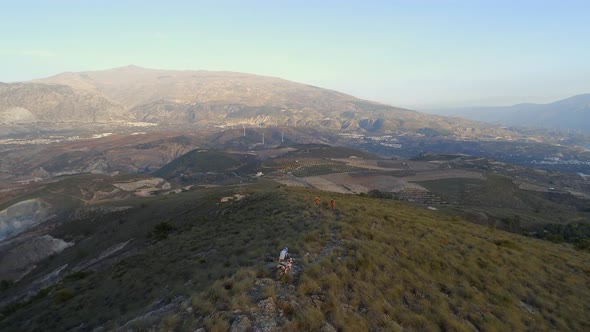 Off Road Motocross Bikers in a Mountainous Landscape