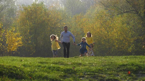 Family running in a park