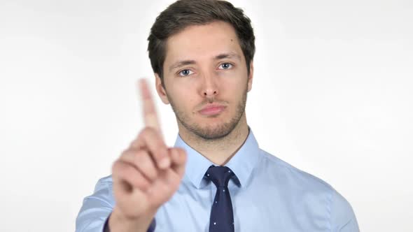 Rejecting Young Businessman Waving Finger on White Background