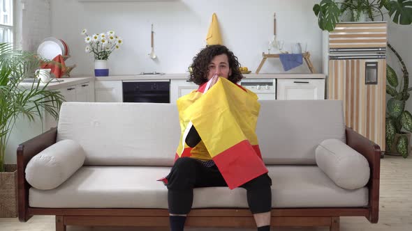 A Male Spanish Football Fan Watches TV at Home