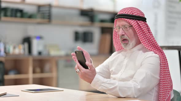 Upset Senior Old Arab Businessman Having Loss Smartphone 