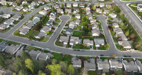 Top down aerial of cul de sacs in a cookie cutter American neighborhood.