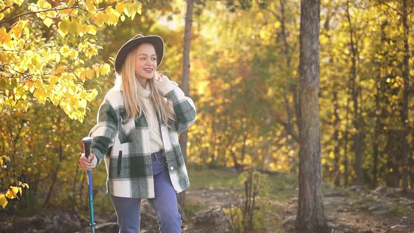 Adorable Caucasian Woman is Posing Near Tree