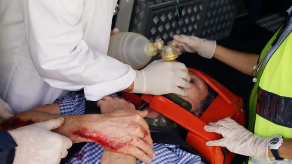 Emergency medical technician holding an oxygen mask