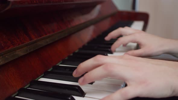 Pianist's Hands are Playing Piano Closeup