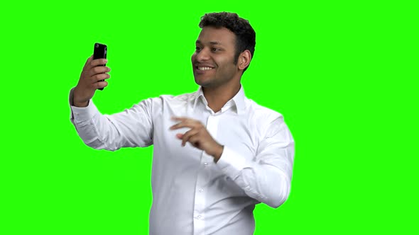 Smiling Young Man Taking Selfie with Mobile Phone