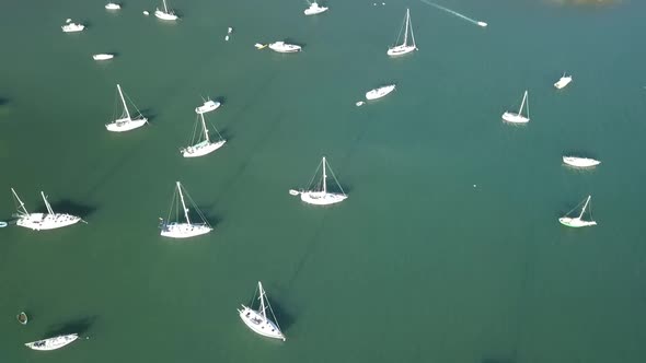 Sailboats anchored in bay from the air Caribbean island drone