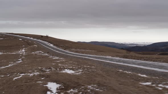 Car in the Mountains of the Caucasus in Winter