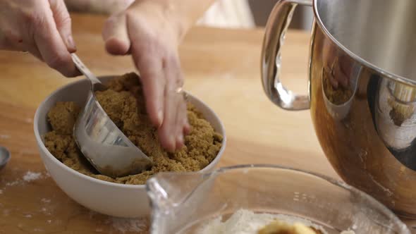 Measuring brown sugar for baking