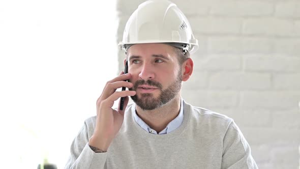 Portrait of Young Engineer Talking on Smartphone