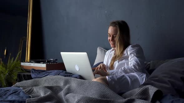 Woman Rests at Home Blonde Lady Surfs Internet Via Laptop Akspb