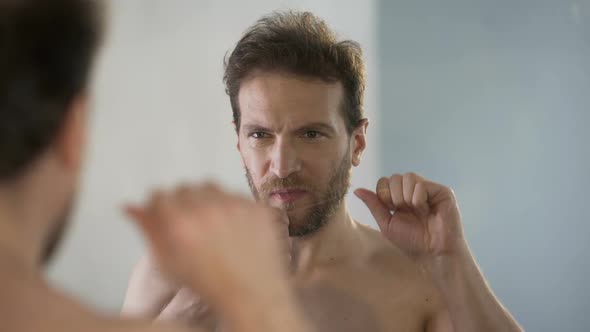 Guy Taking Care of Oral Hygiene, Brushing His Teeth With Dental Floss Every Day