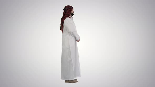 Arab Sheikh Wearing Keffiyeh Standing on Gradient Background
