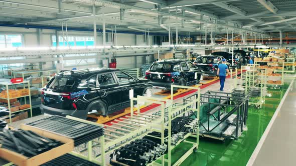 Car Bodies in the Factory Unit in the Process of Assembly. Automobile, Car Factory Conveyor