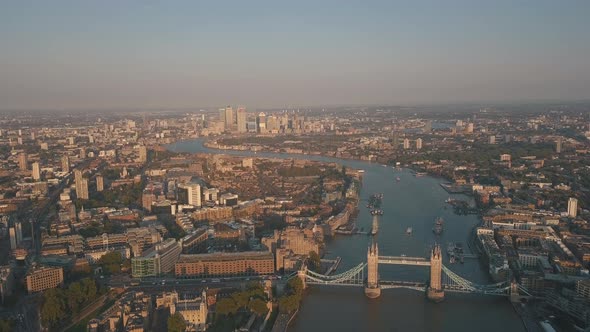 Wide view over London Cityscape at Sunset or Sunrise with Thames River and Tower Bridge, Aerial Pers