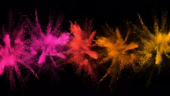 Super Slowmotion Shot of Color Powder Explosions Isolated on Black Background