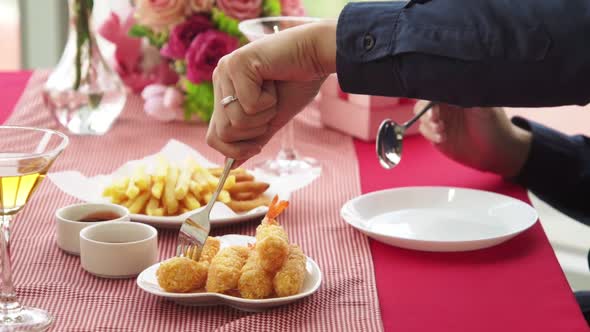 Happy Romantic Couple Eating Lunch at Restaurant