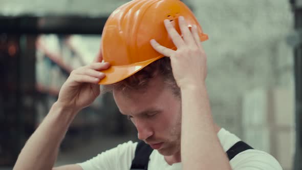 Company Worker Is Putting on a Helmet at the Store